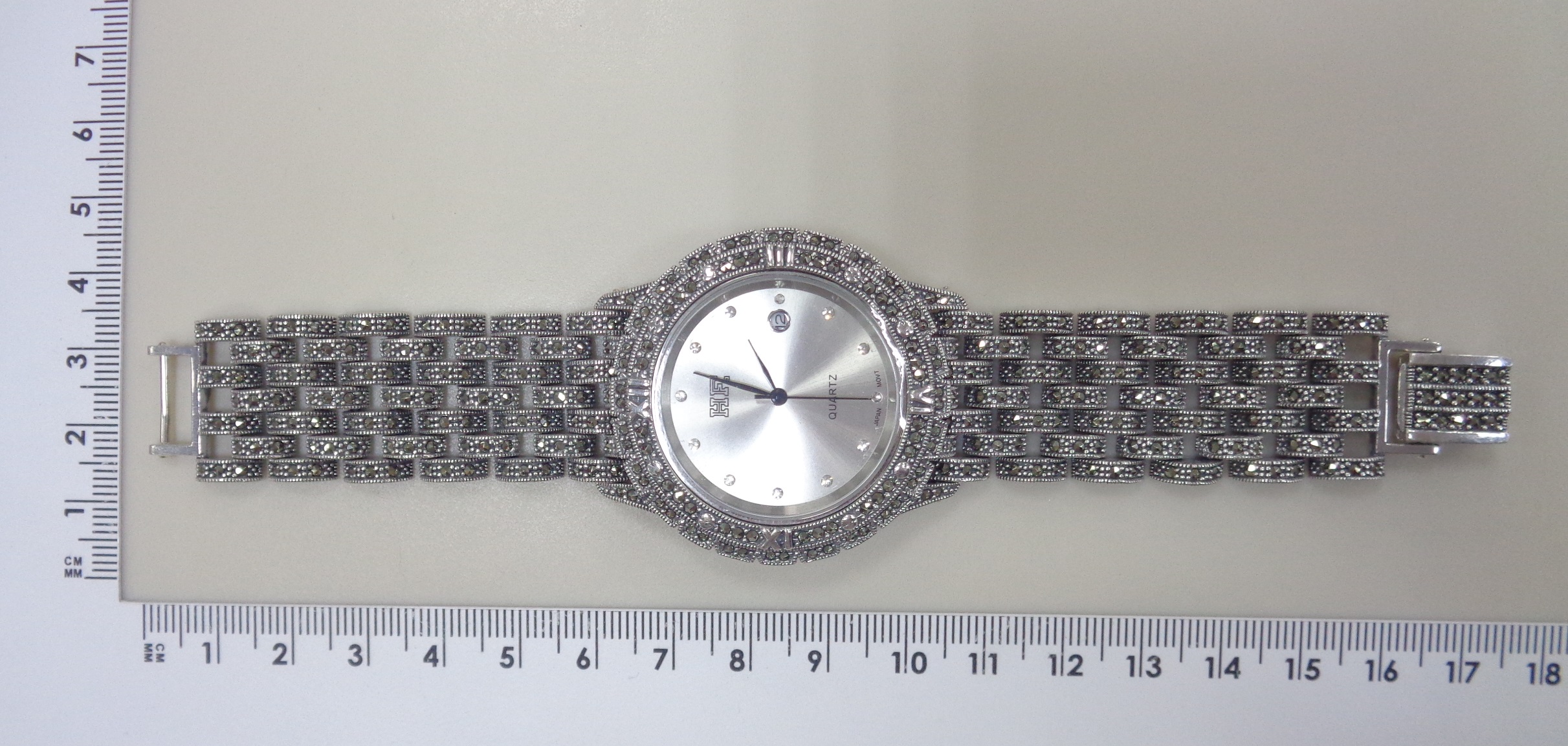 Серебряные часы с марказитами